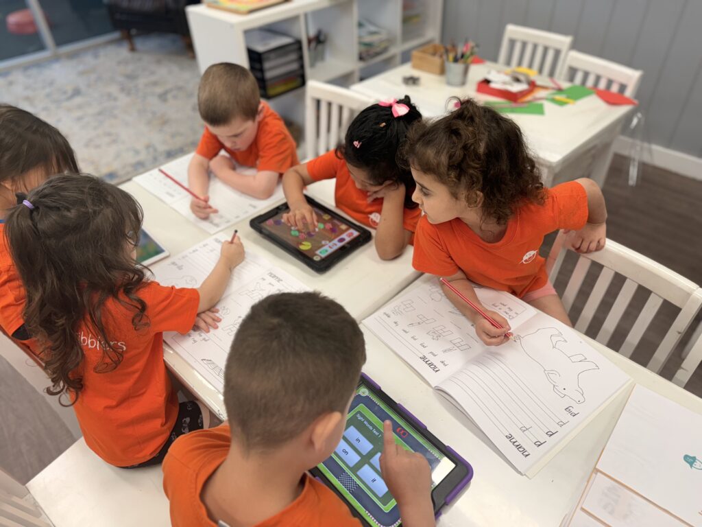 children learning literacy and numeracy with ABC reading eggs and mathseeds at belmore child care centre