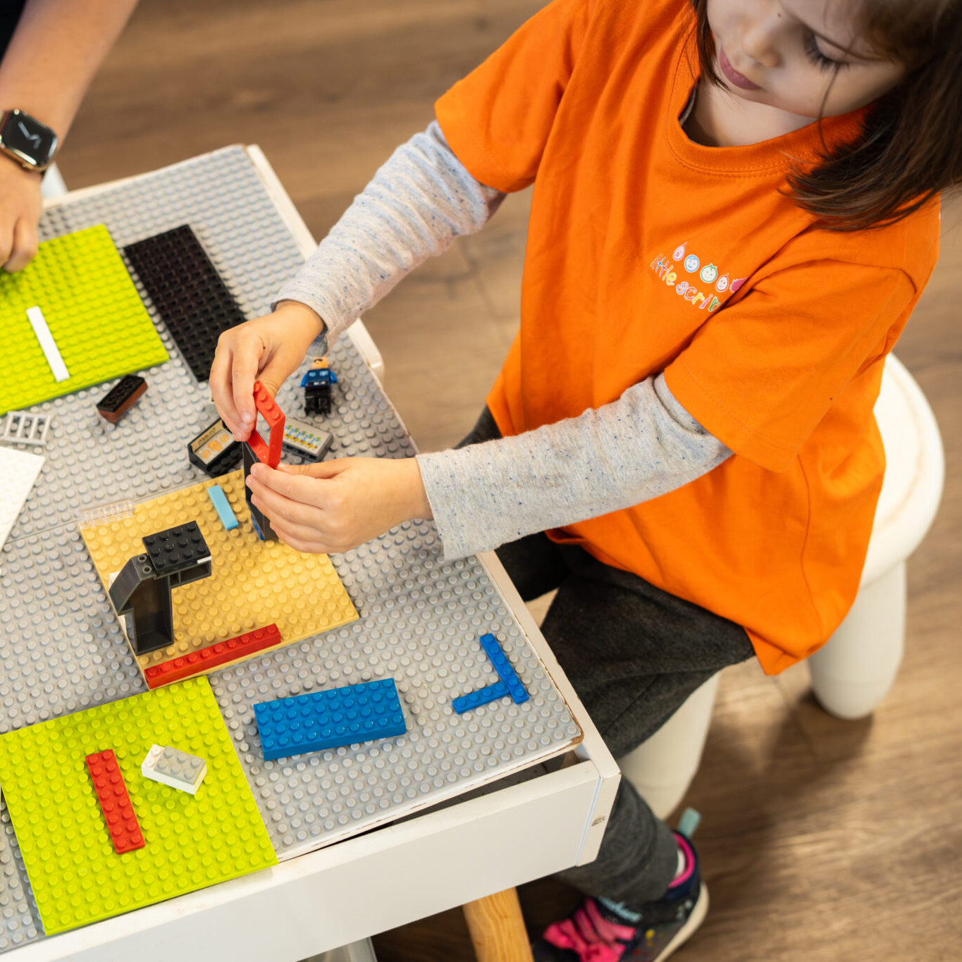 Happy children engaged in a preschool learning activity at child care in caringbah